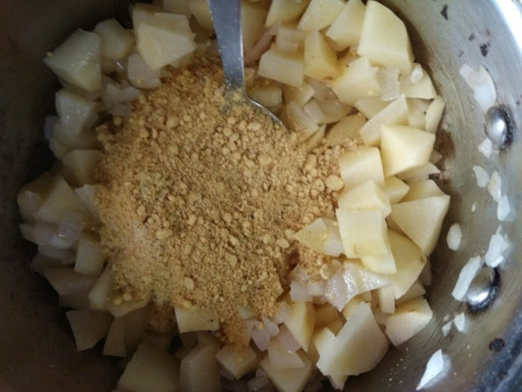 add besan flour to the sauteed onion potato for the soup