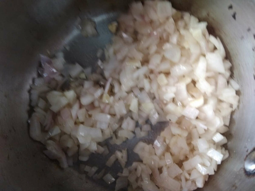 saute onions in olive oil for making potato soup