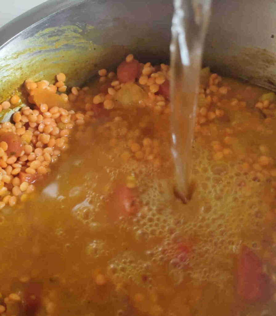 add water to raw red lentils for pressure cooking