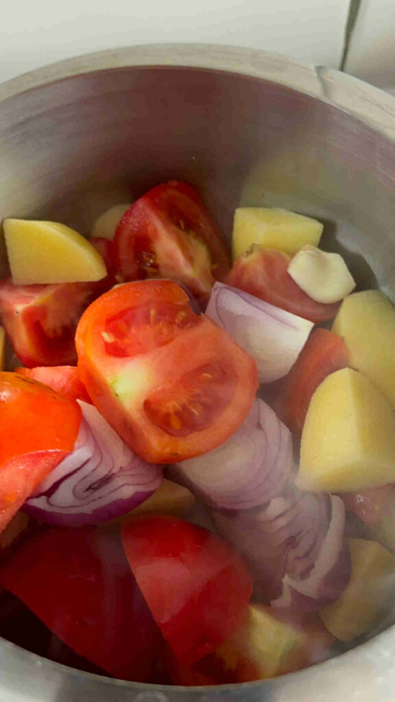 add the chopped veggies to pressure cooker