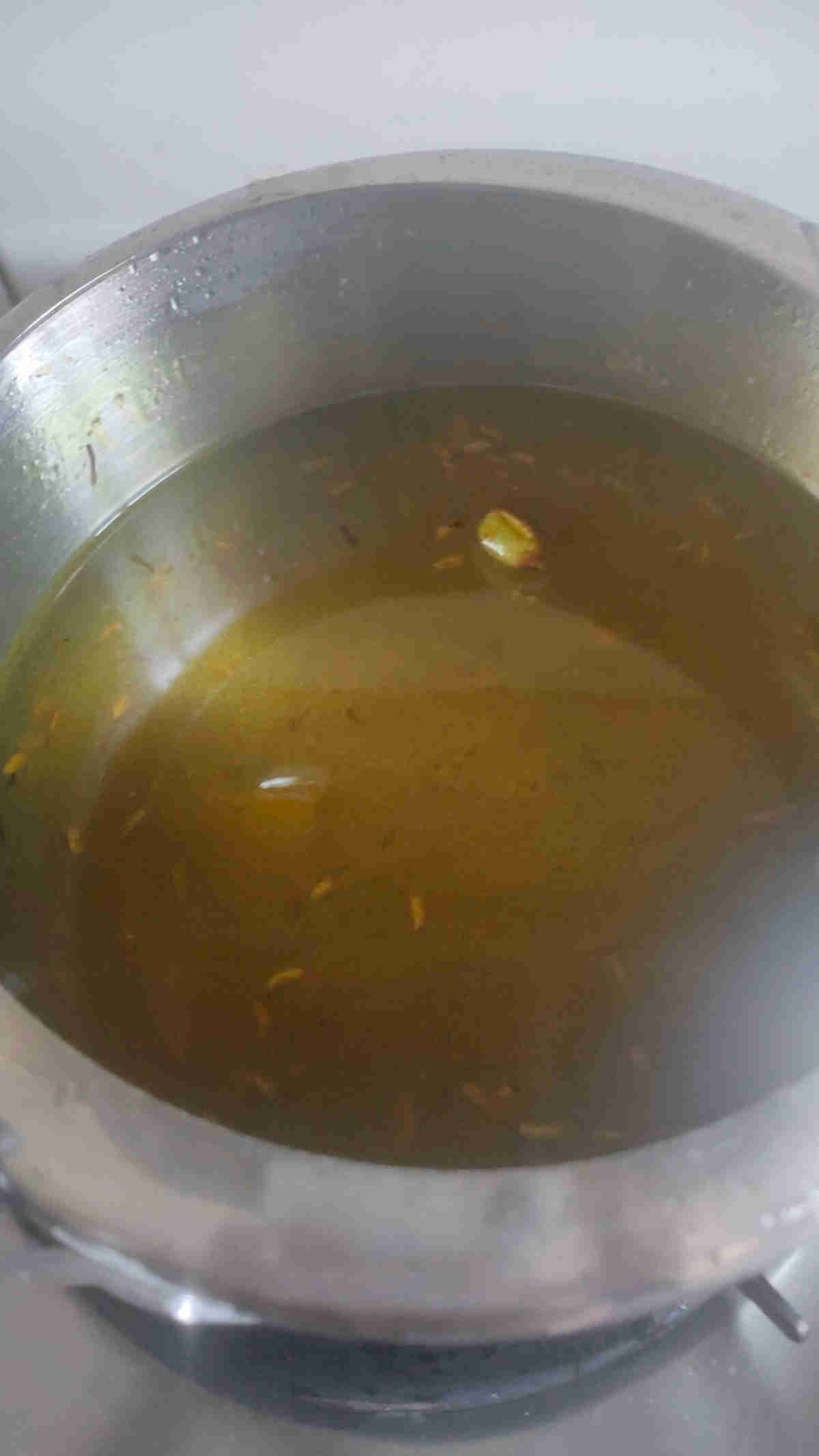 add water to the jaggery rice mixture for pressure cooking