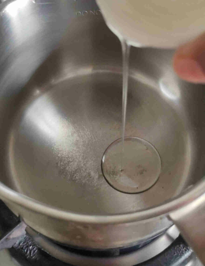 heat olive oil in saucepan for making broccoli almond soup