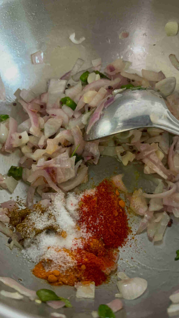 add spices to cooked onions for quinoa upma