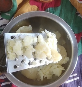 grating potatoes for making mashed potatoes sandwich