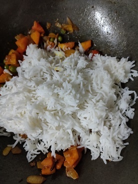 add rice to cooked veggies