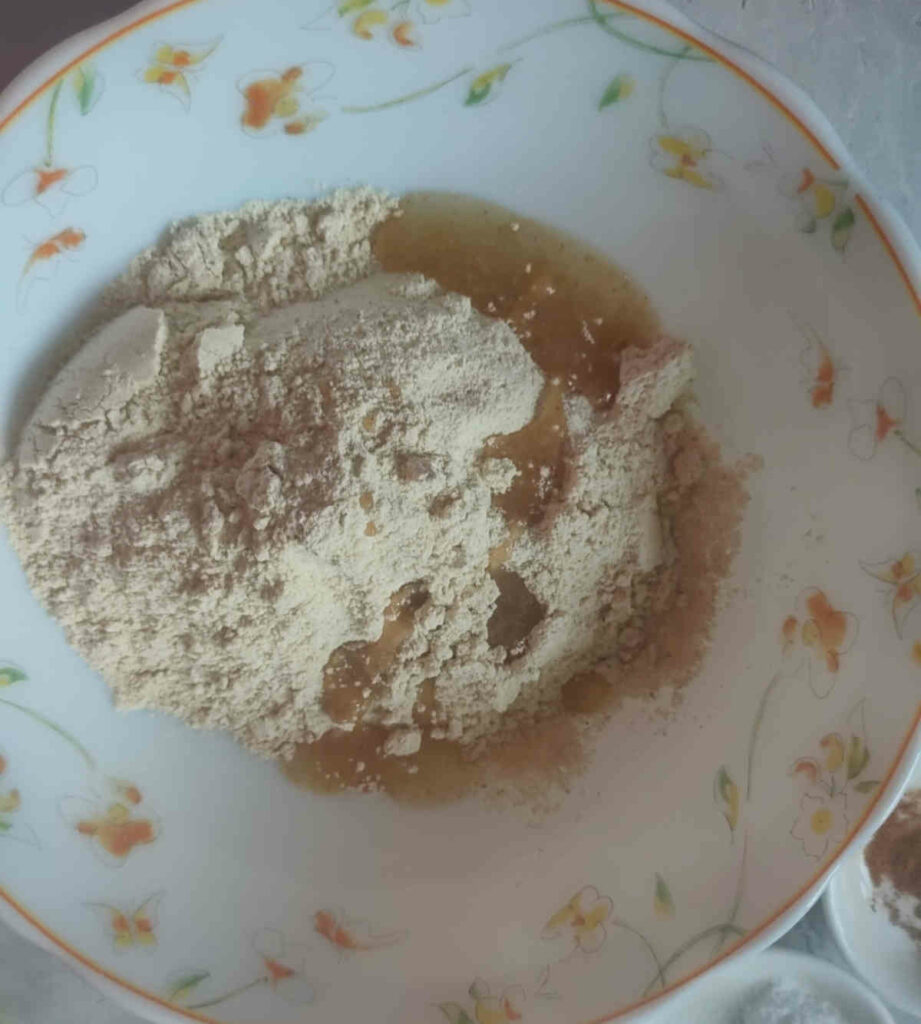 wheat flour with olive oil for making batter of pumpkin rolls