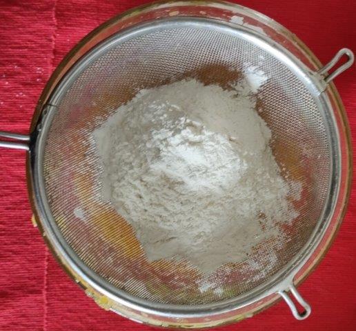 sieve flour and bakind soda in batter
