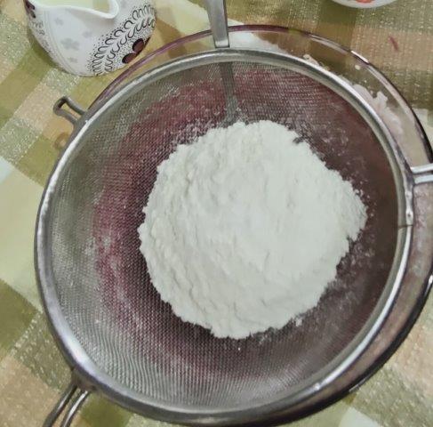 sieve flour into wet mixture for beet muffins