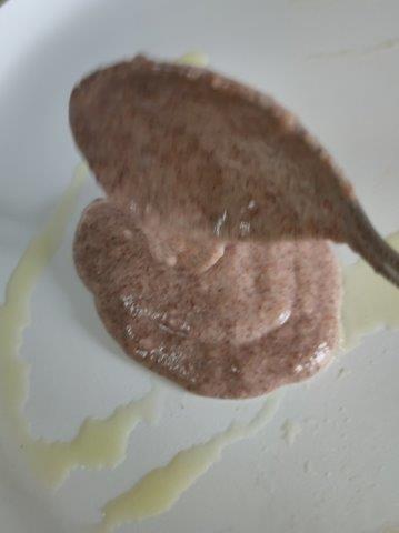spread ragi batter on tawa or pan