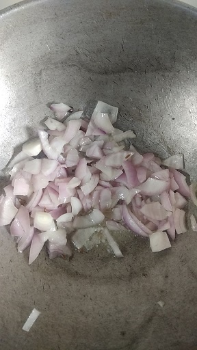 sauteing onion for making tomato rice recipe