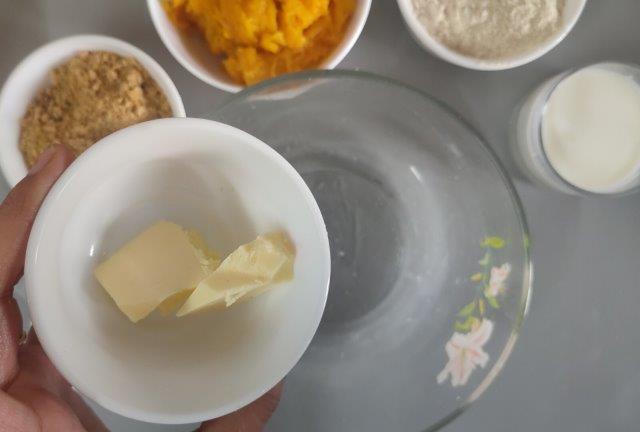 adding butter to a bowl
