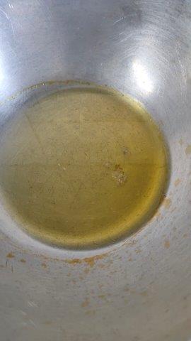 heat mustard oil in wok for making garlic green chilly 