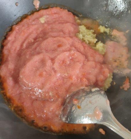add tomato puree to the cooked ginger garlic  paste