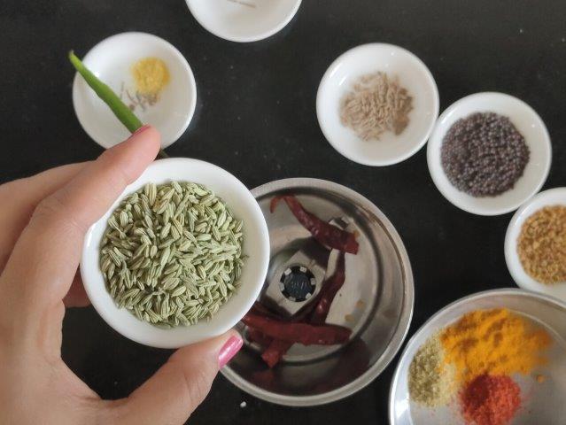 adding whole spices to jar