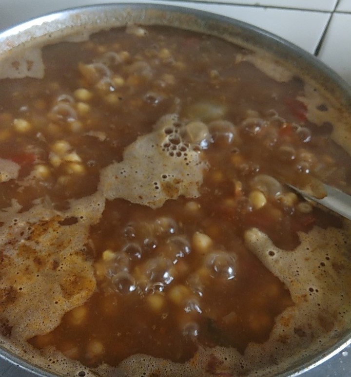 chickpea boiling on slow flame after added to gravy