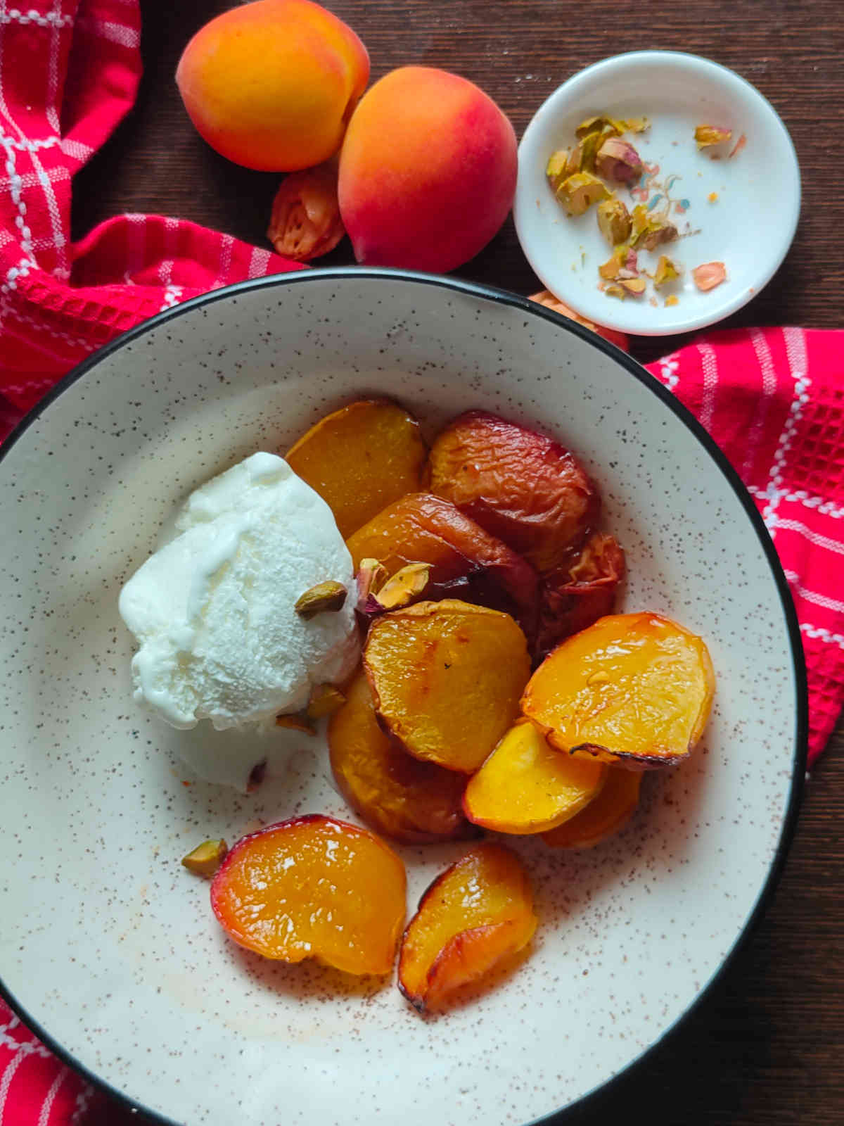 air fryer grilled peaches served with vanilla and pistachios