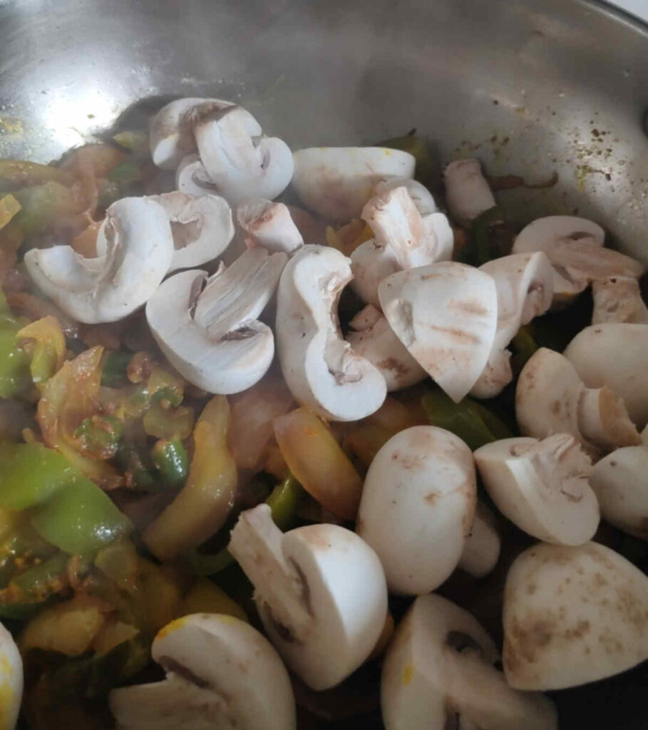 add mushrooms to cooked veggies