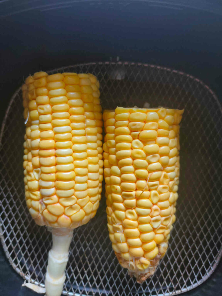 place the corn cob in air fryer basket