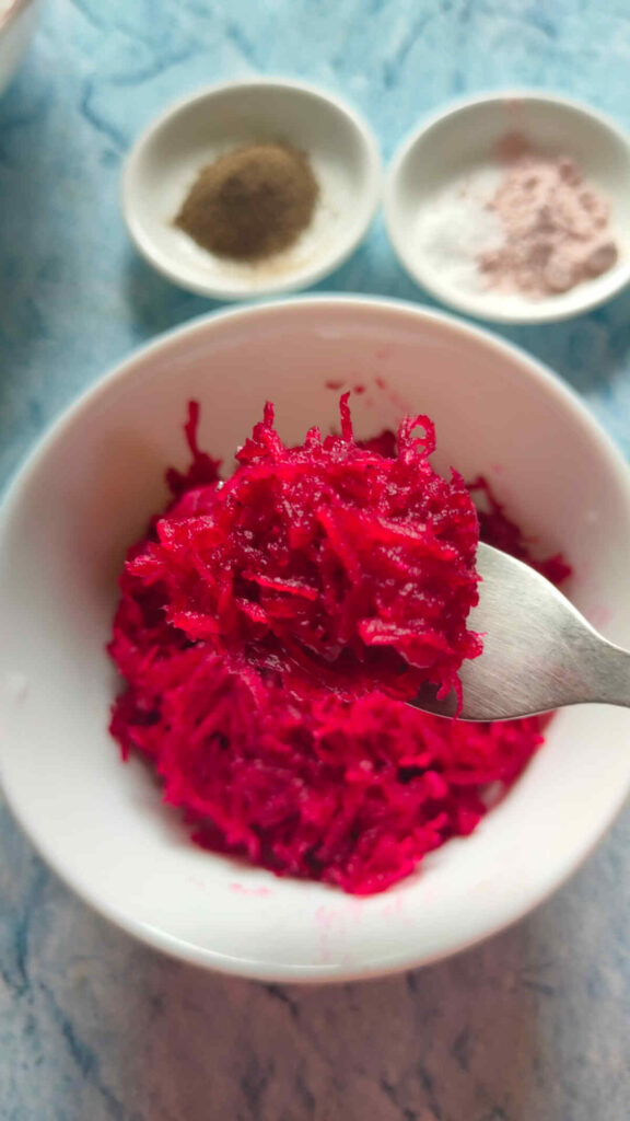 collect the grated beet in a bowl for making beet raita