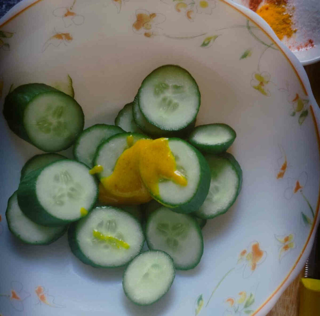 mustard sauce over sliced cucumbers for air frying