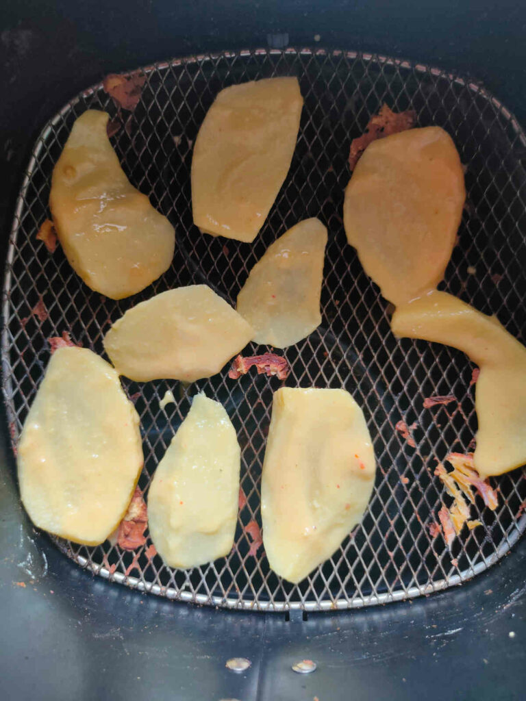 potato besan coated in air fryer basket 