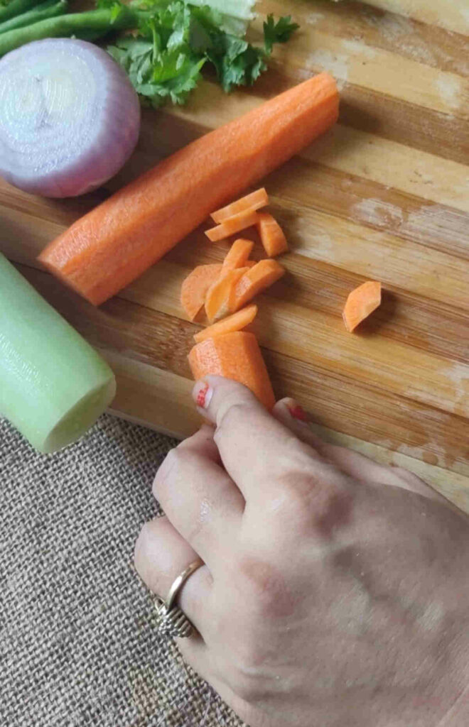 chopping carrots for filling of rice paper dumplings