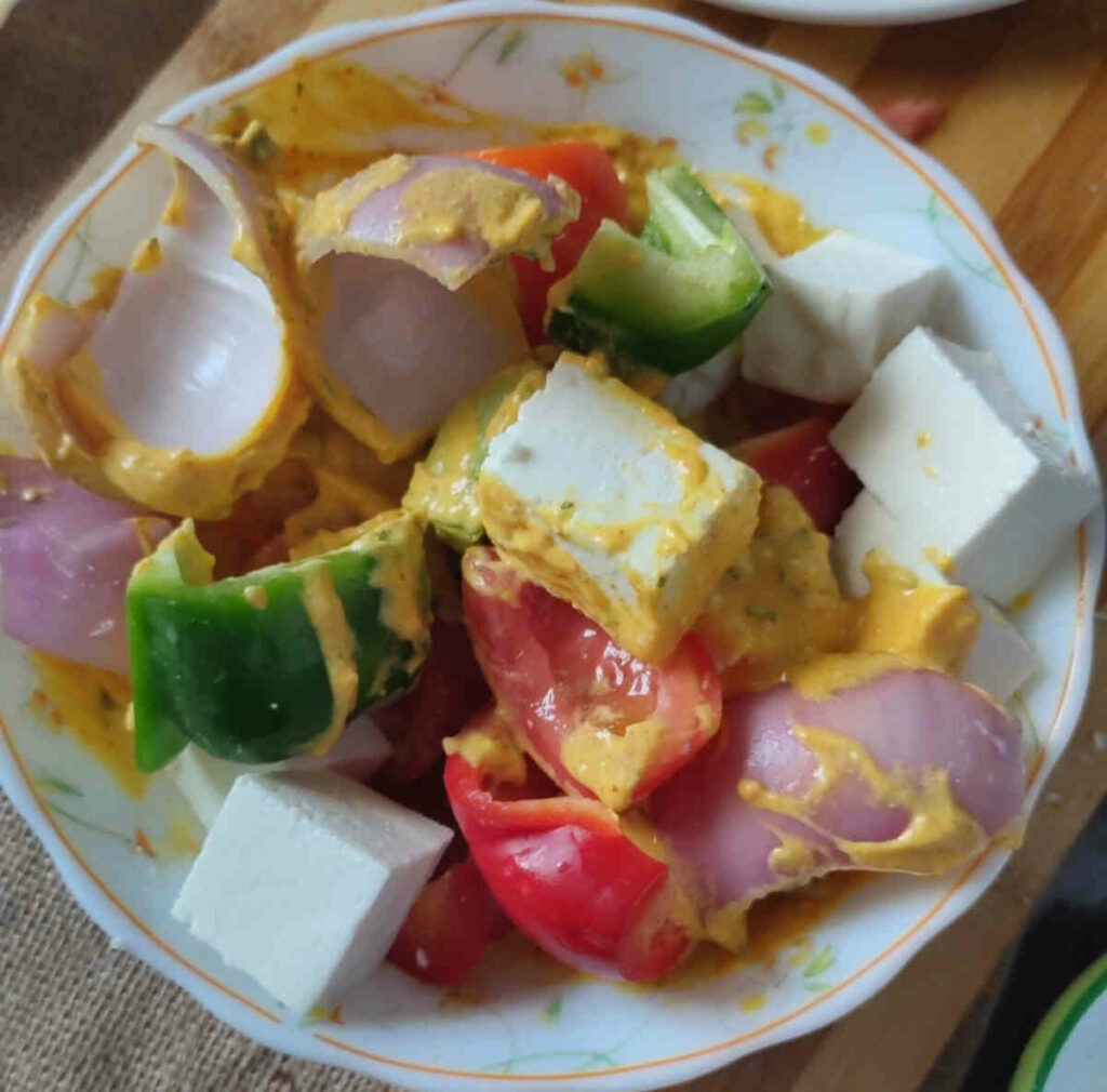 dice veggies and paneer cubes added to marinade