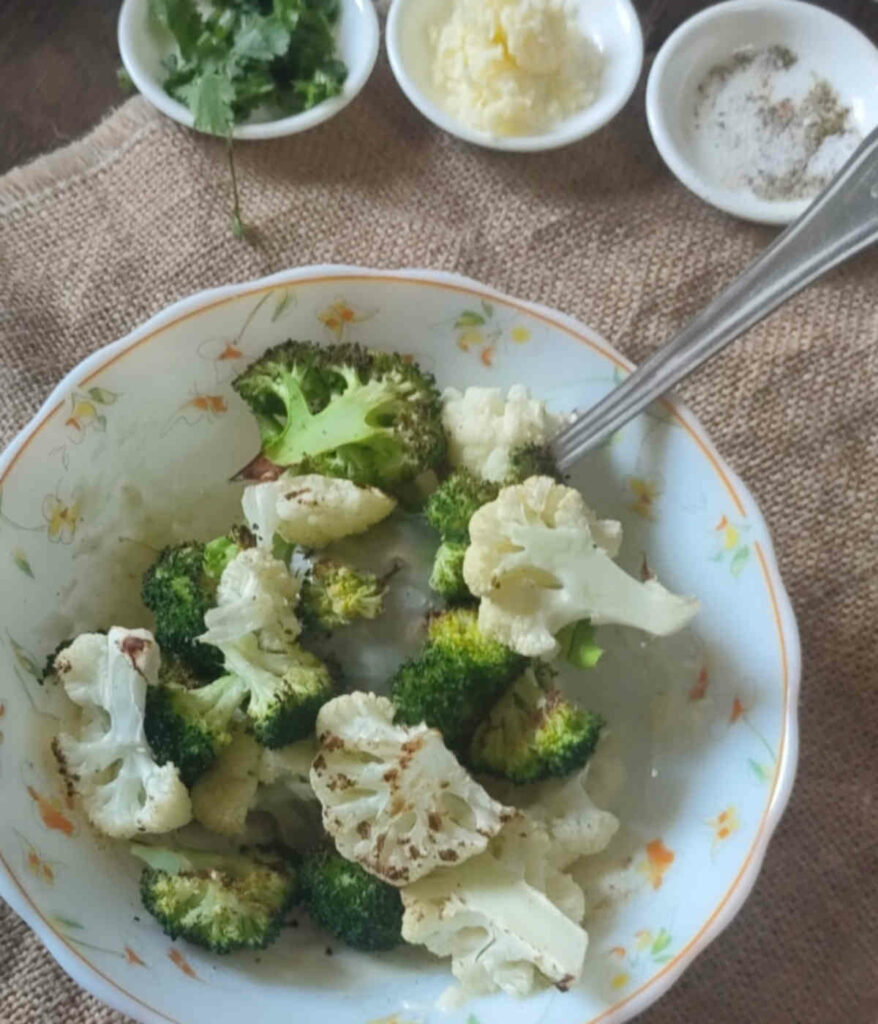 mix cream cheese sauce with baked broccoli cauliflower