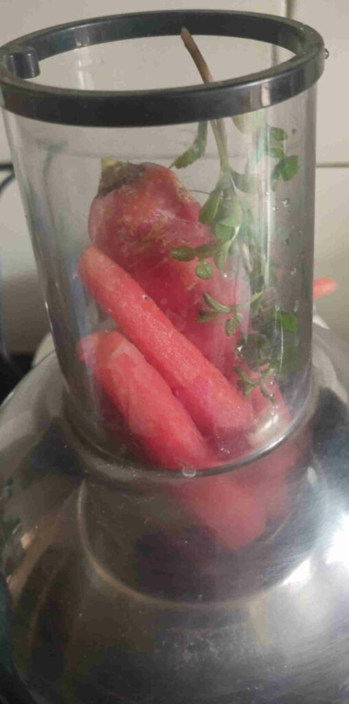 add ingredients to the juicer for carrot beet juice