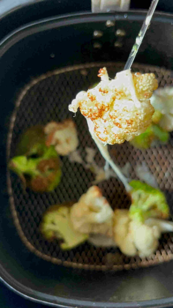 broccoli cauliflower air fried with spices, salt cheddar cheese