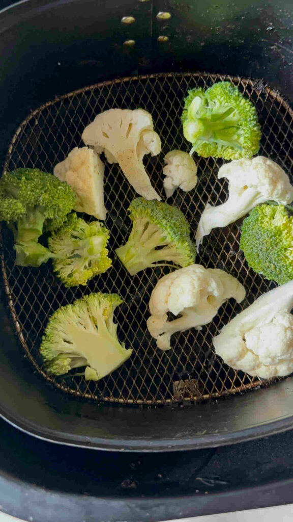 place the broccoli cauliflower florets in air fryer